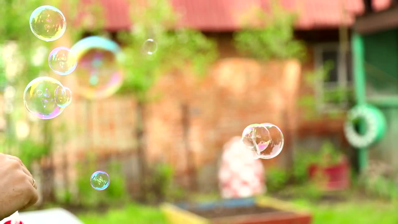 Stock Video Making Bubbles With Soap Animated Wallpaper
