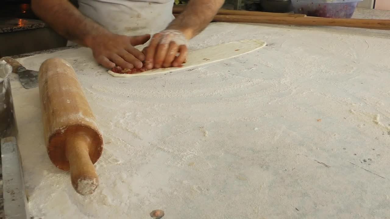 Stock Video Making A Turkey Style Pizza Animated Wallpaper