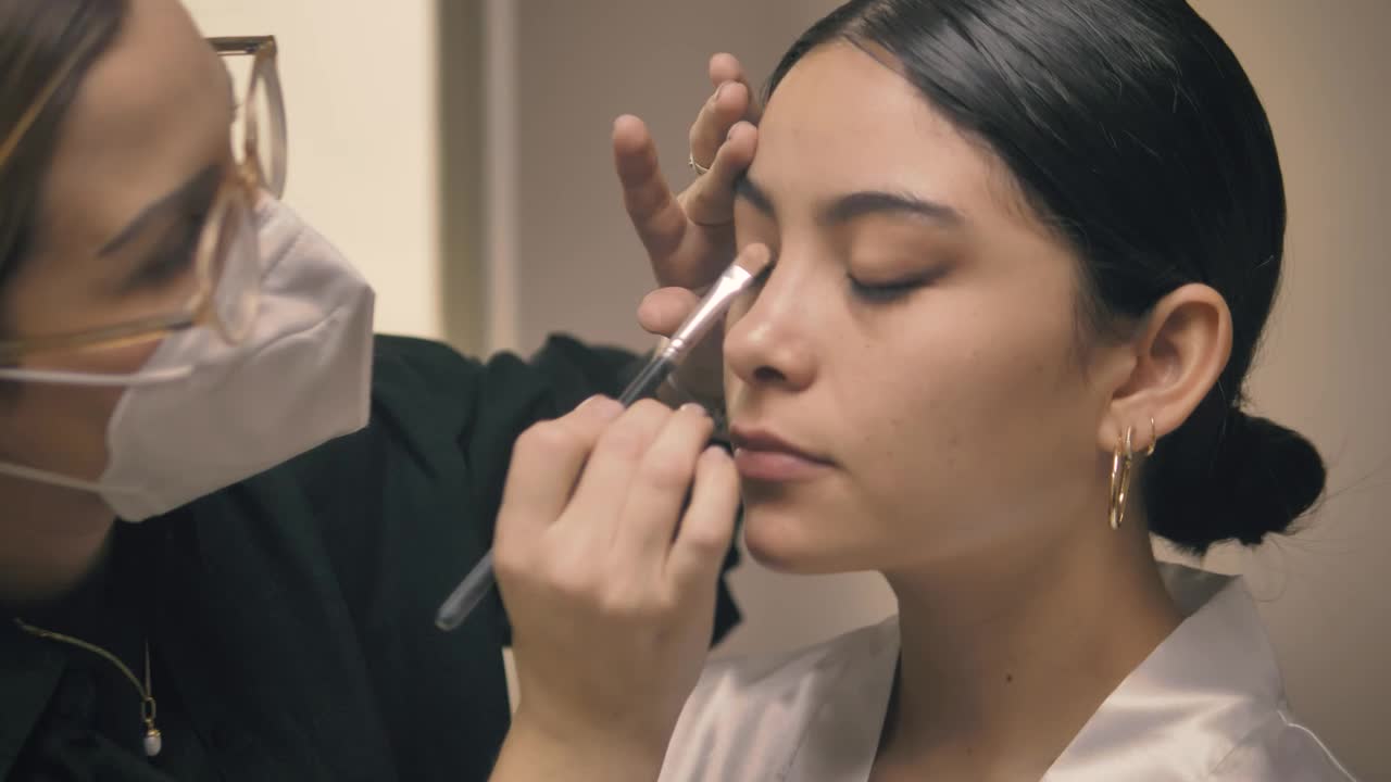 Stock Video Makeup Artist Working On The Face Of A Bride Animated Wallpaper