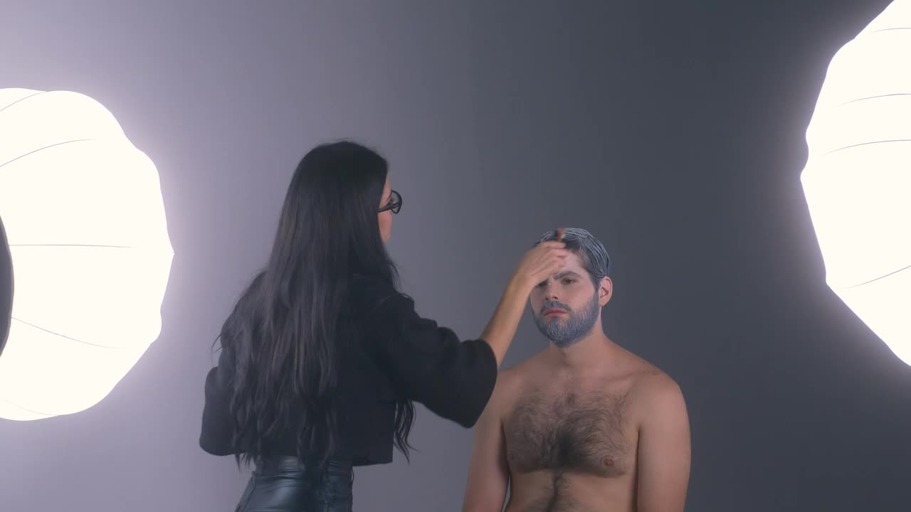 Stock Video Makeup Artist Retouching A Mans White Hair Animated Wallpaper