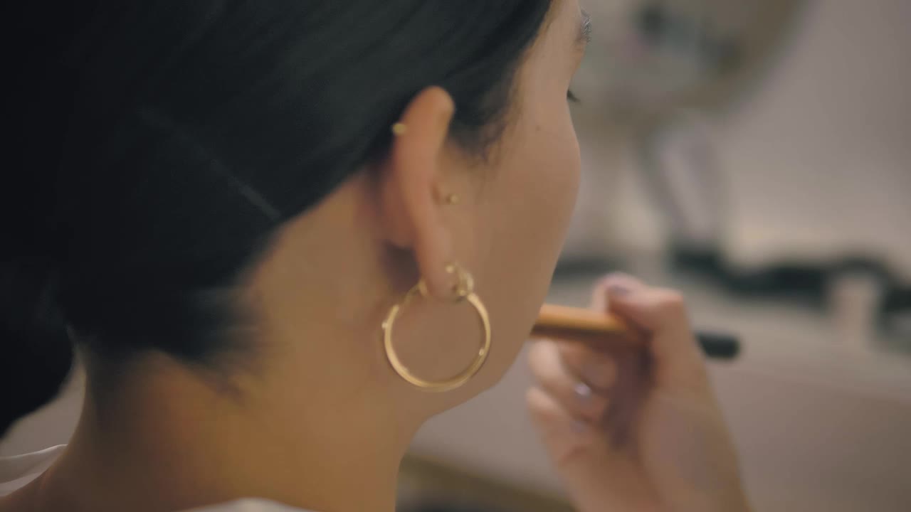 Stock Video Makeup Artist Applying Highlighter Animated Wallpaper