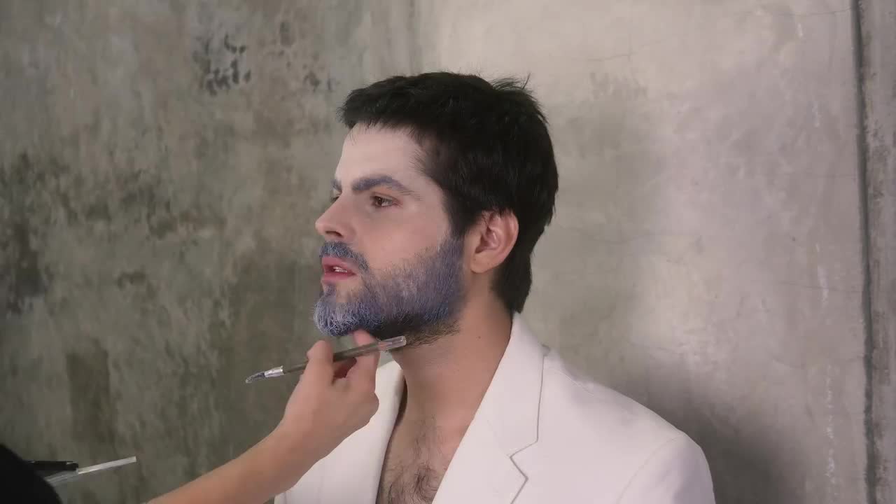 Stock Video Make Up Artist Making Up A Man With Winter Style Animated Wallpaper