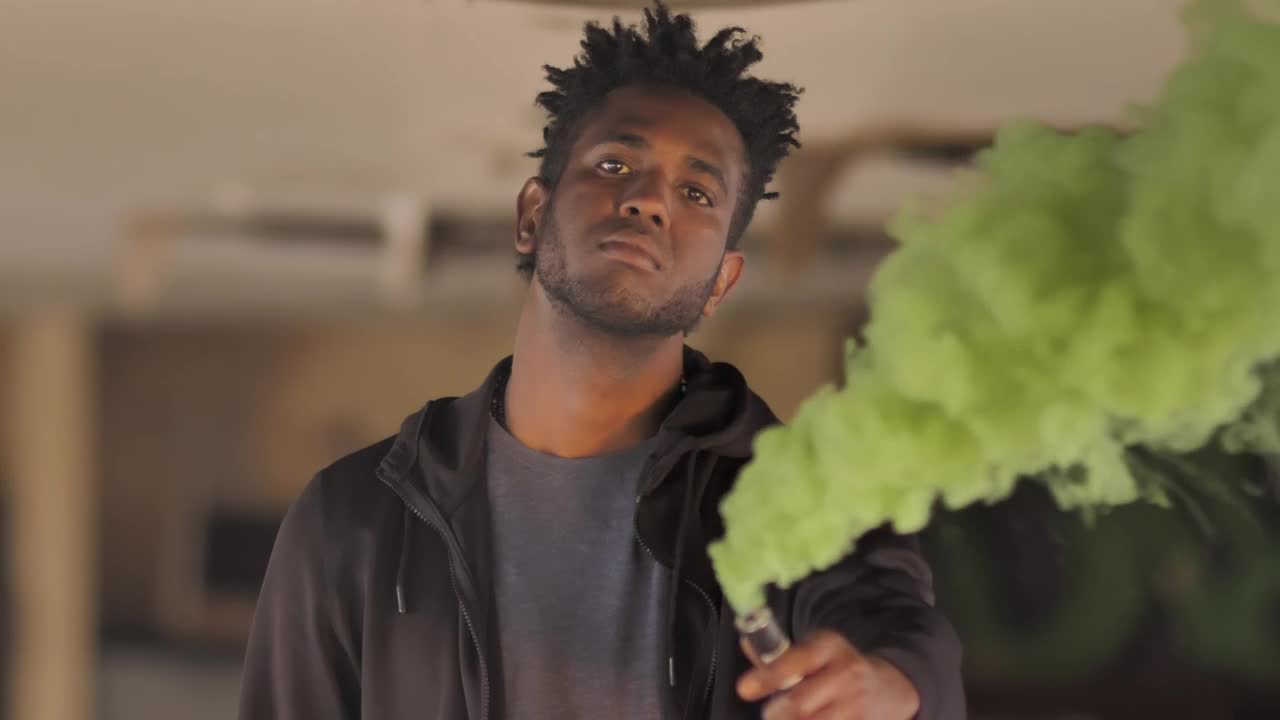 Stock Video Mad Man Holding A Smoke Bomb Animated Wallpaper