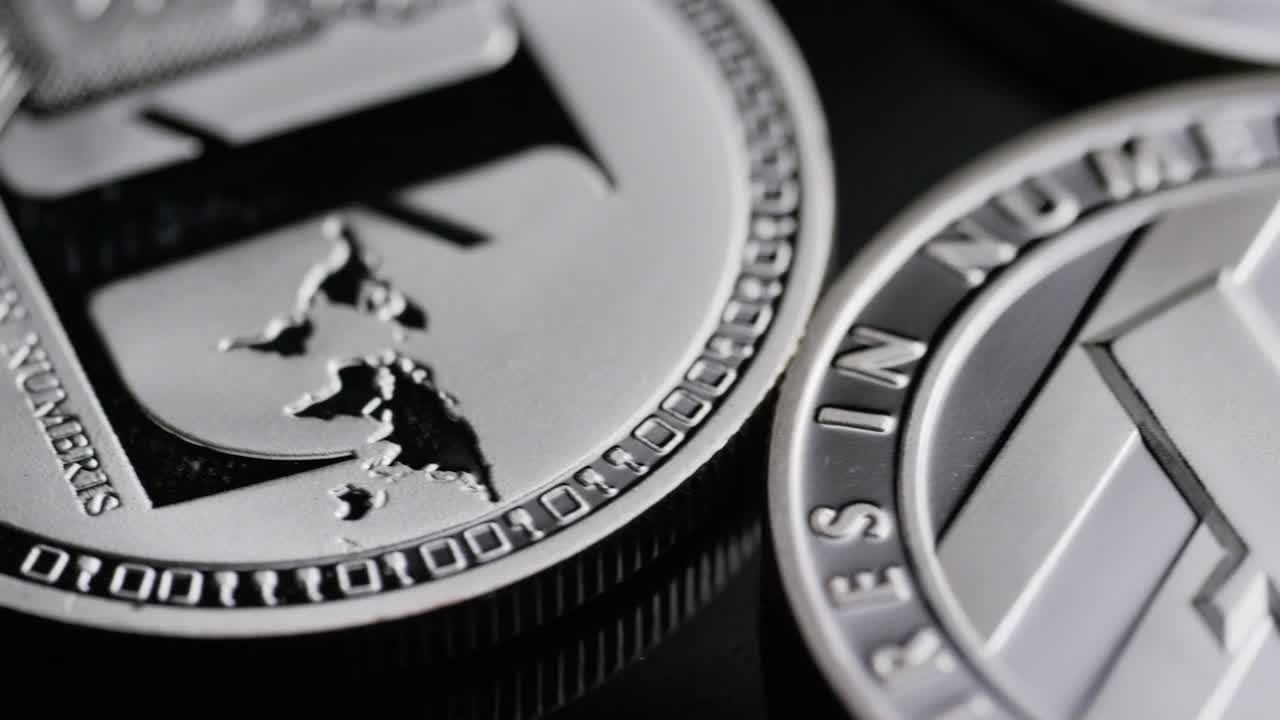 Stock Video Macro Shot Of Lite Cryptocurrency Coins Animated Wallpaper