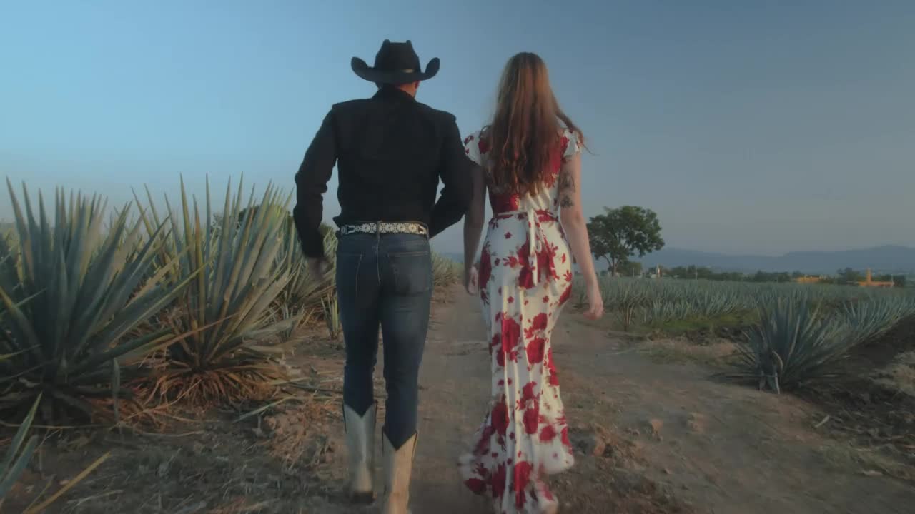 Stock Video Loving Couple Walking Through A Mexican Ranch Animated Wallpaper