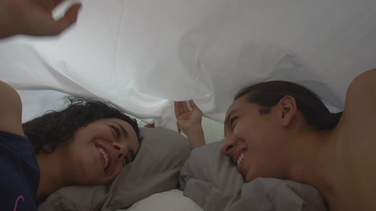 Stock Video Loving Couple Looking At Each Other Appreciatively In Bed Animated Wallpaper