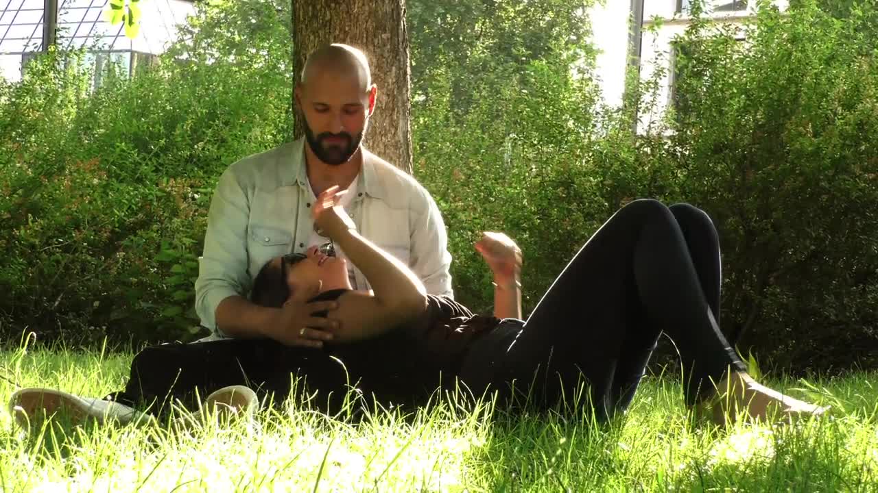 Stock Video Lovers Chatting In A Park Garden Animated Wallpaper