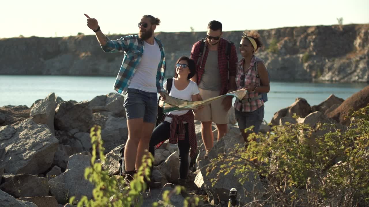 Stock Video Lost Tourists Searching The Map Near The Lake Animated Wallpaper