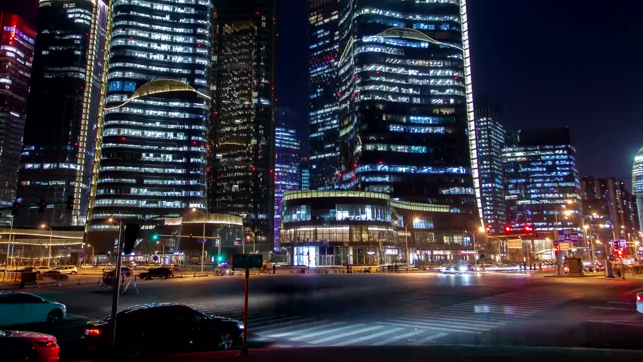 Stock Video Looking Up At Large Buildings In A City At Night Animated Wallpaper