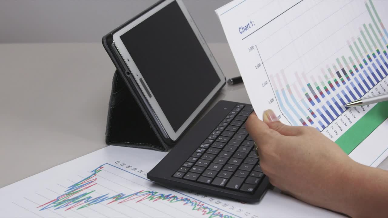 Stock Video Looking At Graphs Animated Wallpaper