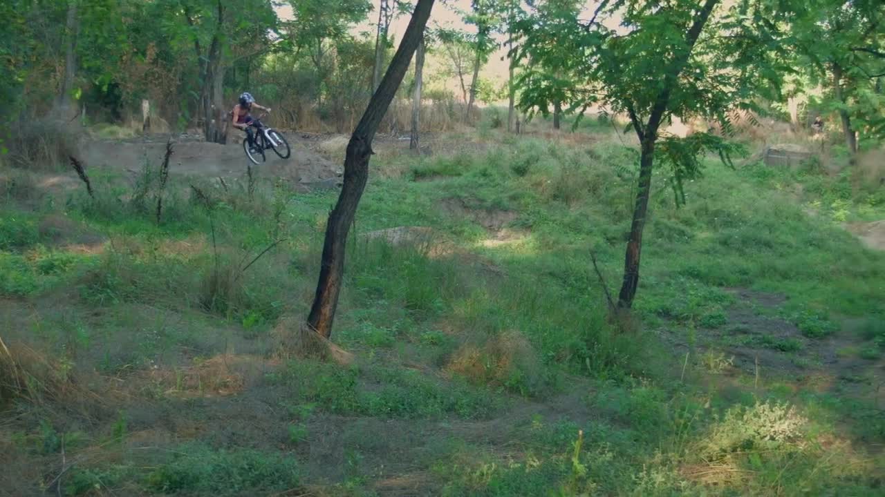 Stock Video Long Jump In The Bicycle On A Rural Road Animated Wallpaper