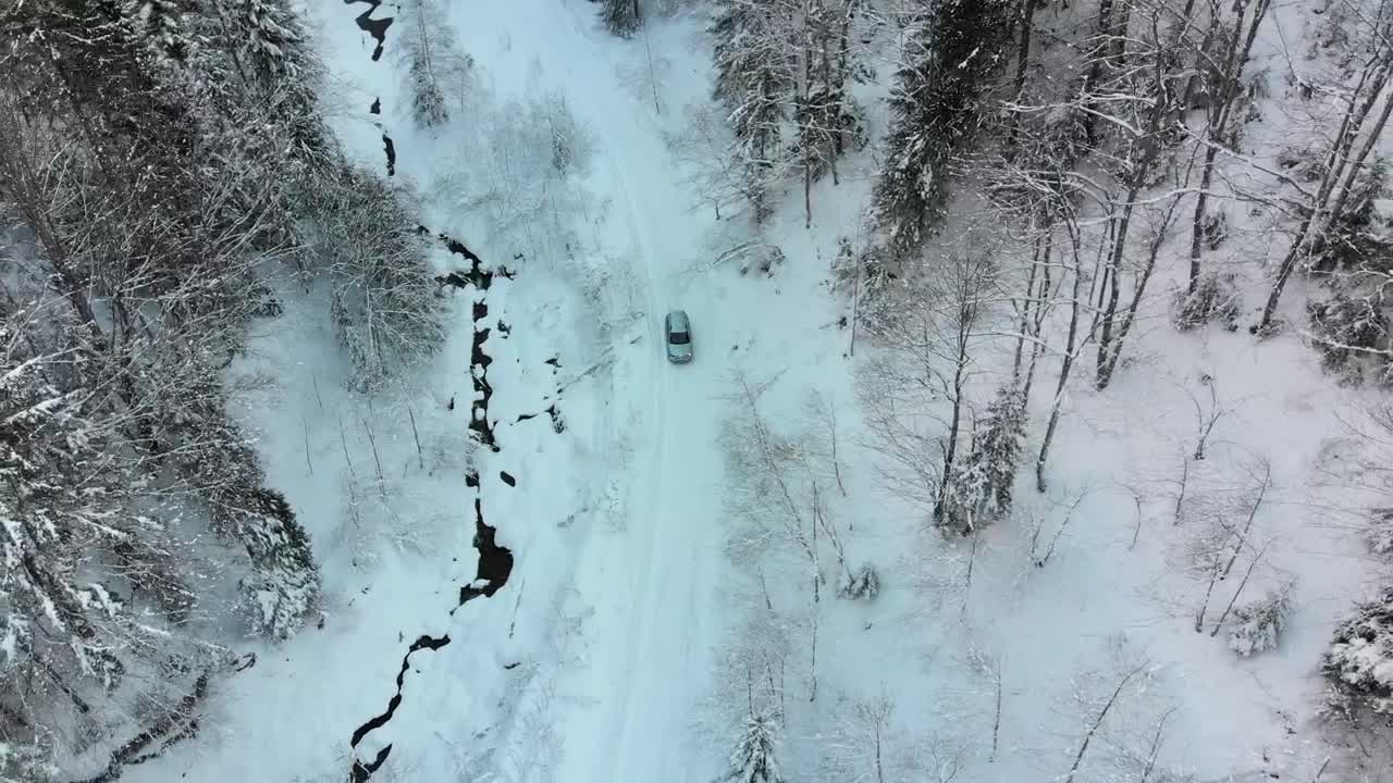 Stock Video Lonely Car Driving On A Snowy Road Animated Wallpaper