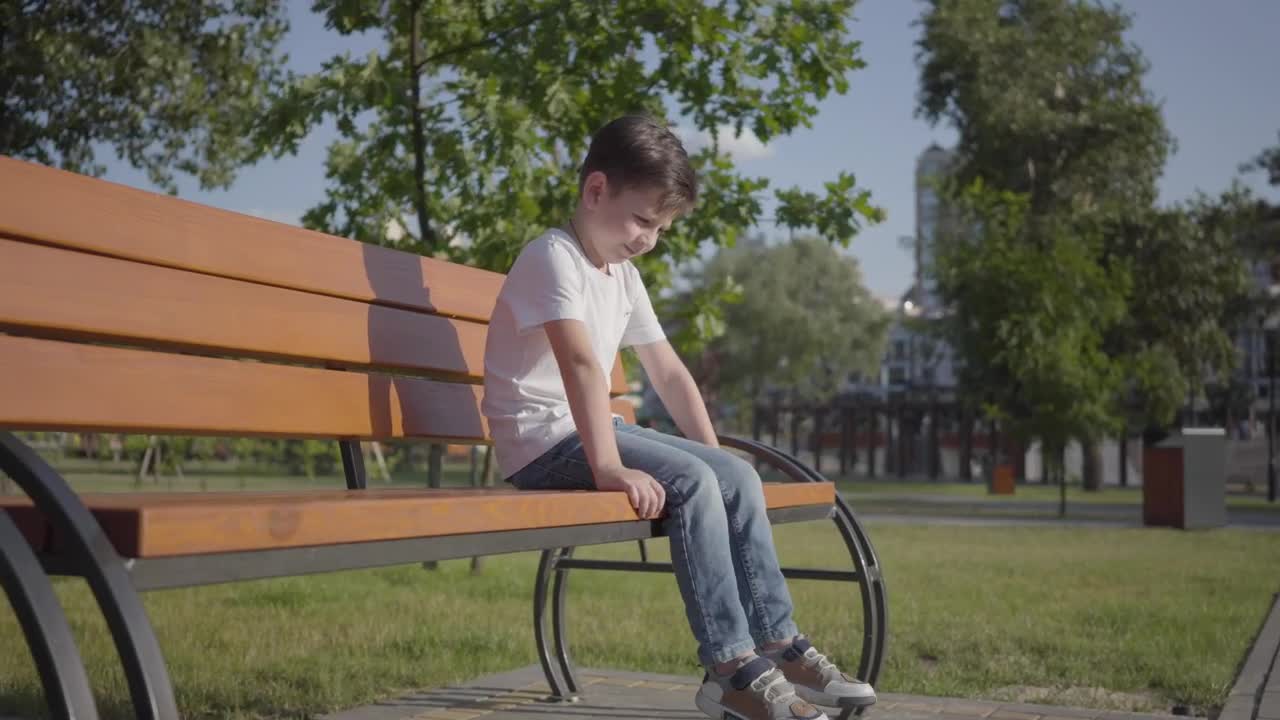 Stock Video Lonely Boy On A Park Bench Animated Wallpaper
