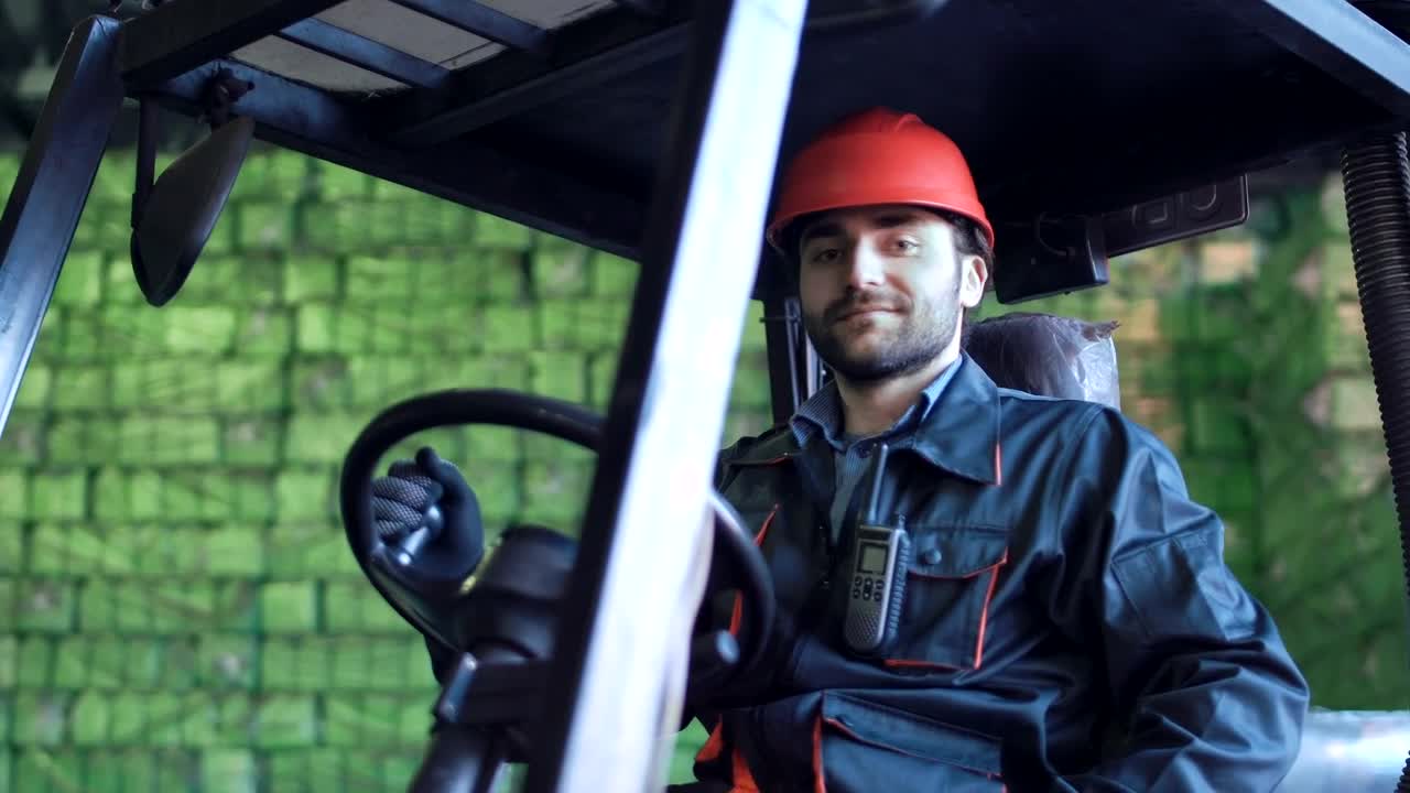 Stock Video Loading Vehicle Operator Smiling To The Camera Animated Wallpaper