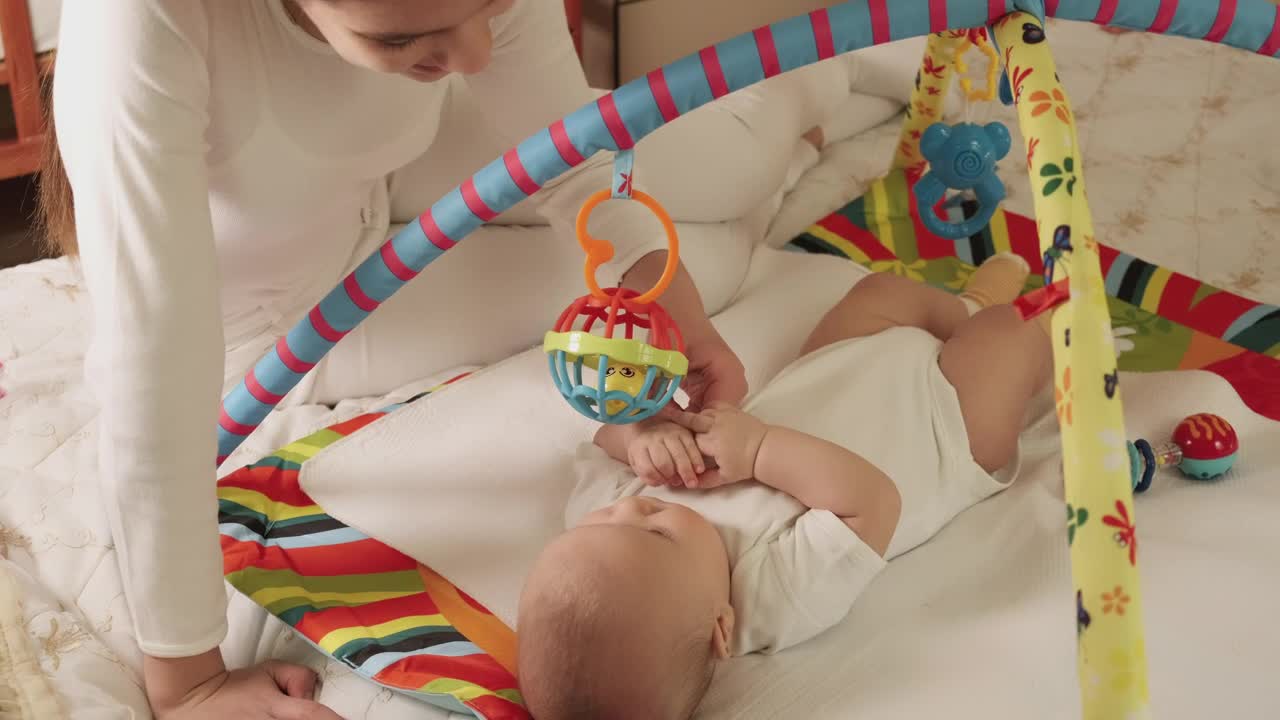 Stock Video Little Sister Plays With Her Baby Brother Animated Wallpaper