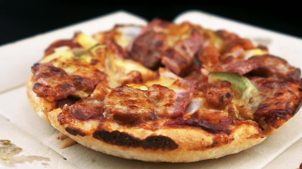 Stock Video Little Pizza Slowly Turning Animated Wallpaper