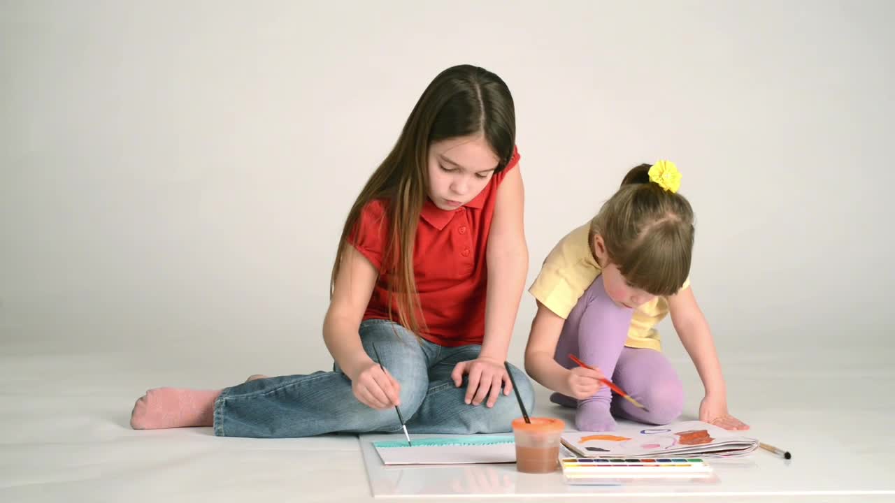 Stock Video Little Girls Painting On The Floor Animated Wallpaper
