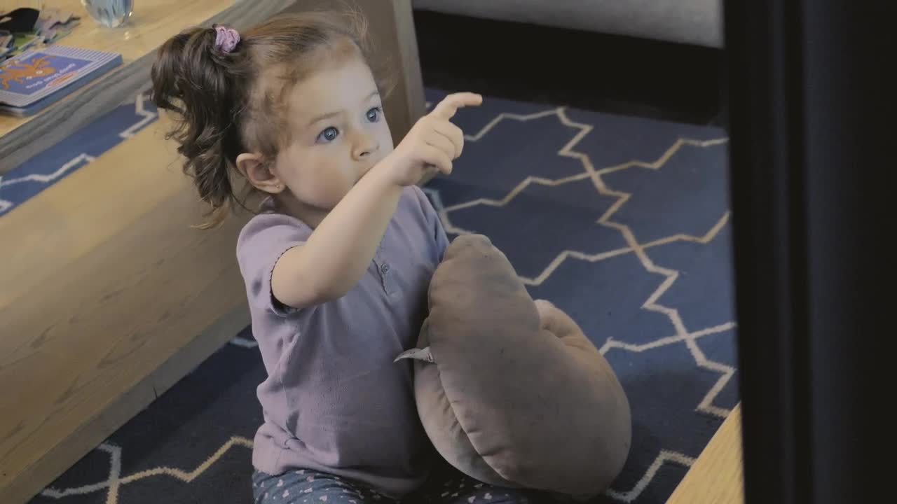 Stock Video Little Girl Watching Tv Animated Wallpaper