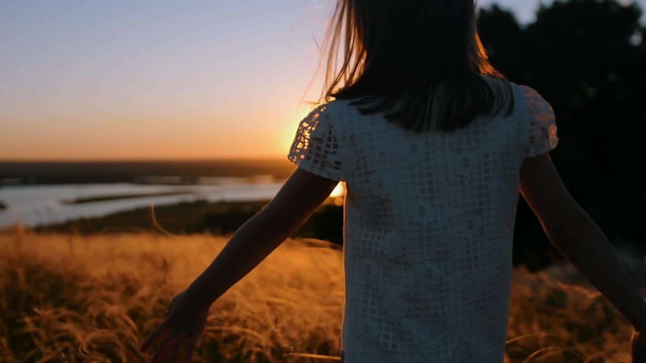 Stock Video Little Girl Walking In The Valley At Sunset Animated Wallpaper