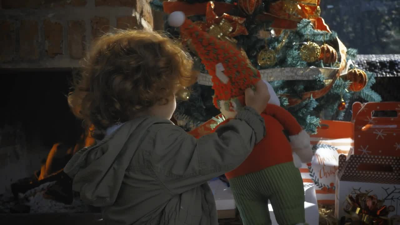 Stock Video Little Girl Taking A Gift From The Christmas Tree Animated Wallpaper