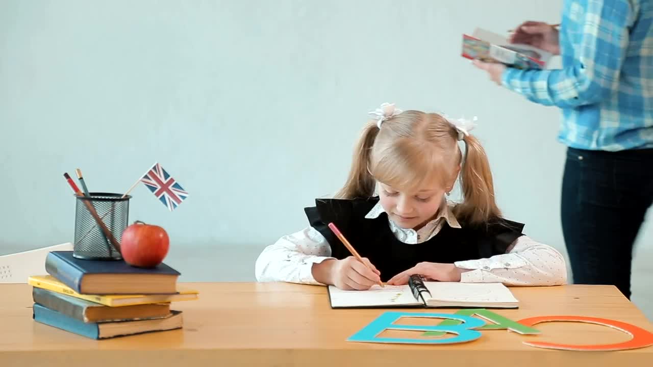 Stock Video Little Girl Studying For Her Exam With Her Teacher Animated Wallpaper