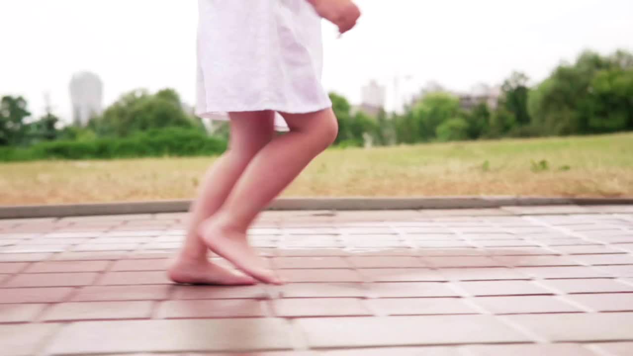 Stock Video Little Girl Running In The Rain Animated Wallpaper