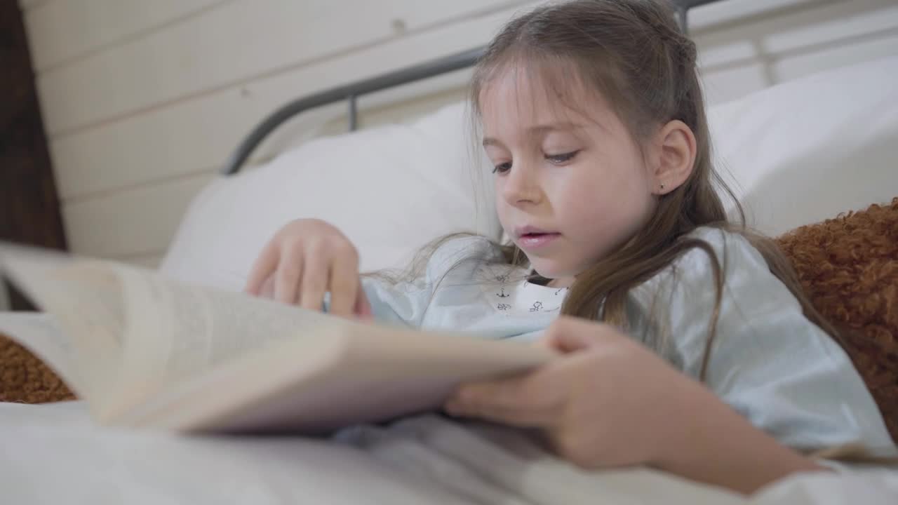 Stock Video Little Girl Reads A Story In A Book Animated Wallpaper
