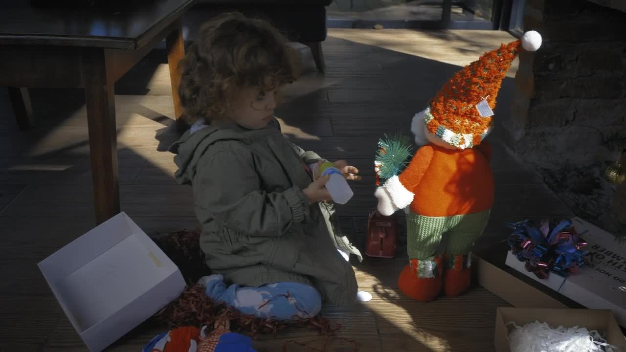 Stock Video Little Girl Playing With Gifts On Christmas Morning Animated Wallpaper