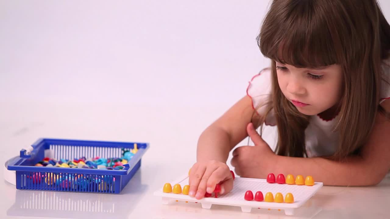 Stock Video Little Girl Playing A Board Game Animated Wallpaper
