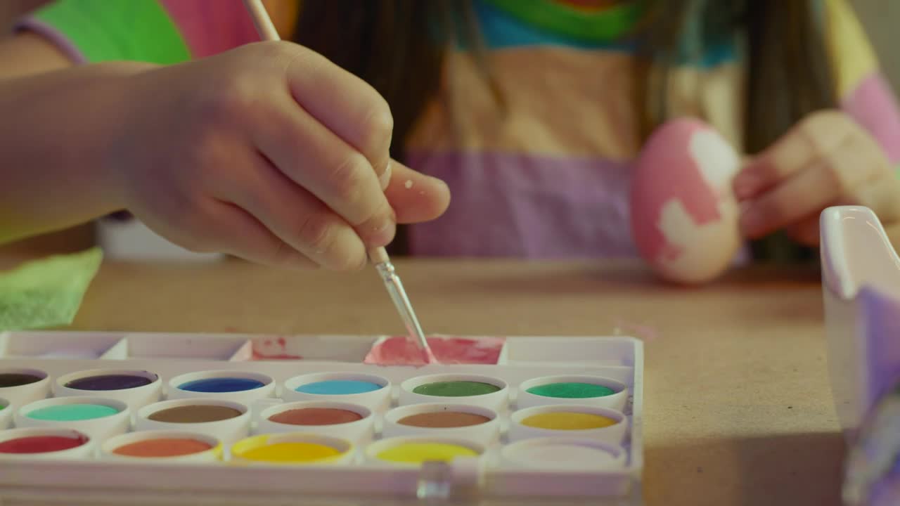 Stock Video Little Girl Painting An Egg With Pink Paint Animated Wallpaper