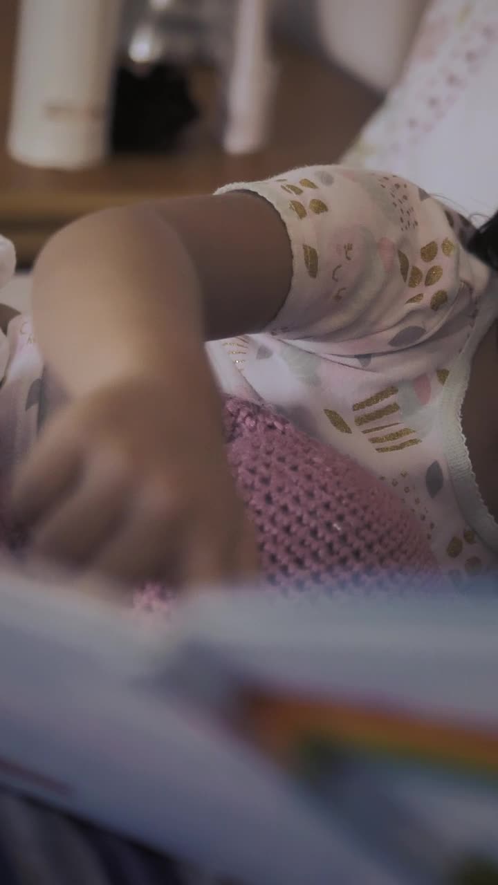Stock Video Little Girl Lying Next To Mom Watching A Storybook With Animated Wallpaper
