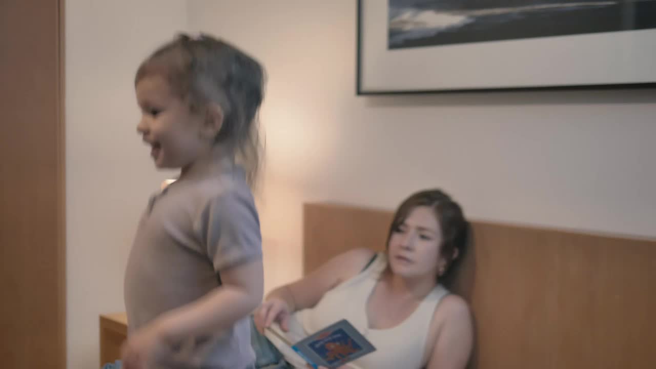 Stock Video Little Girl Jumping On The Bed Animated Wallpaper