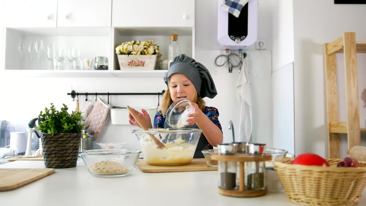 Stock Video Little Girl In The Kitchen Preparing Cookies Animated Wallpaper