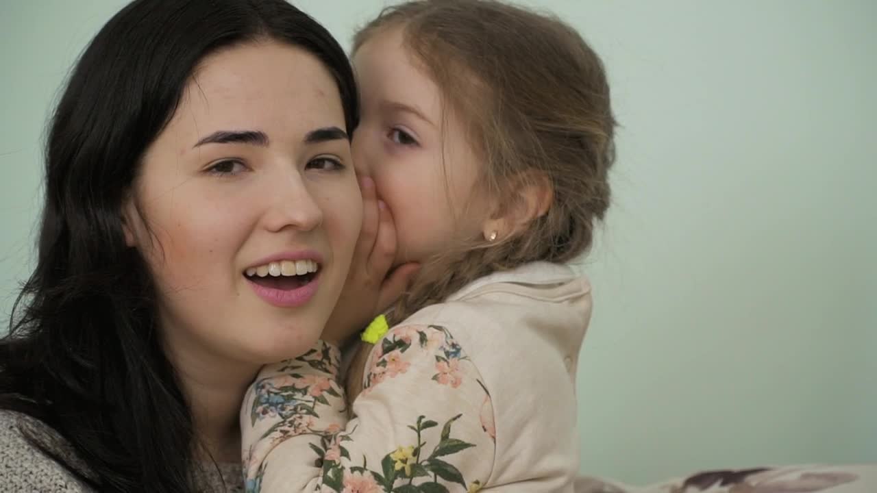 Stock Video Little Girl Gossips In Moms Ear Animated Wallpaper