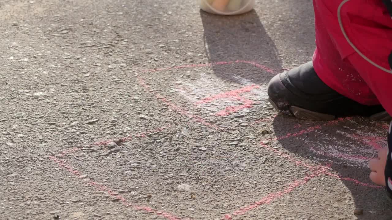 Stock Video Little Girl Drawing On The Ground Animated Wallpaper