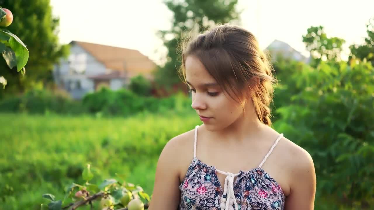 Stock Video Little Girl Collecting Apples In A Garden Animated Wallpaper