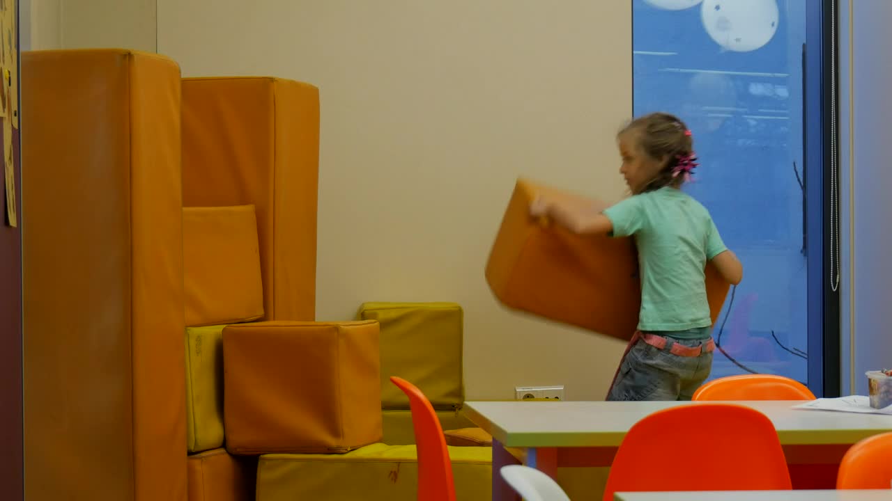 Stock Video Little Girl Building A Wall At School Animated Wallpaper
