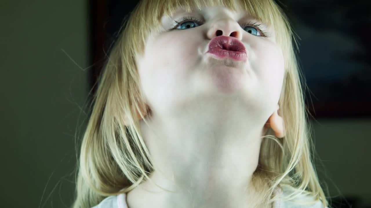 Stock Video Little Cute Girl Kissing To The Camera Animated Wallpaper