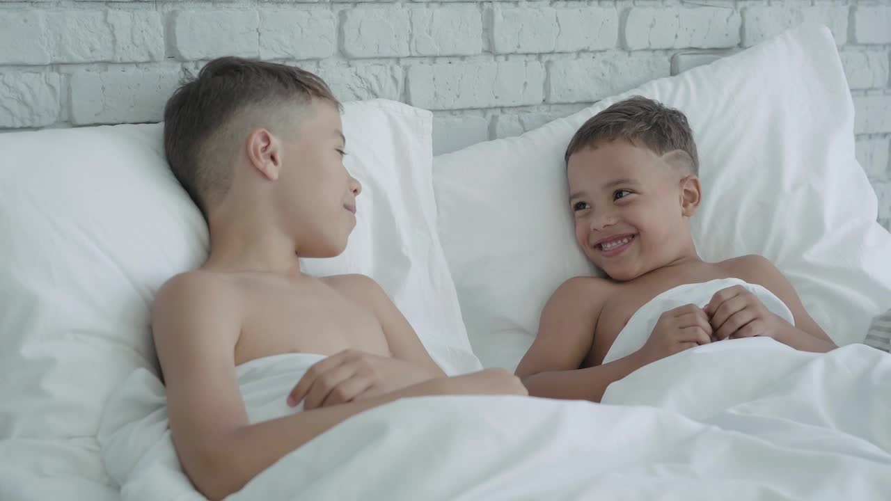 Stock Video Little Brothers Tell Each Other Secrets Animated Wallpaper