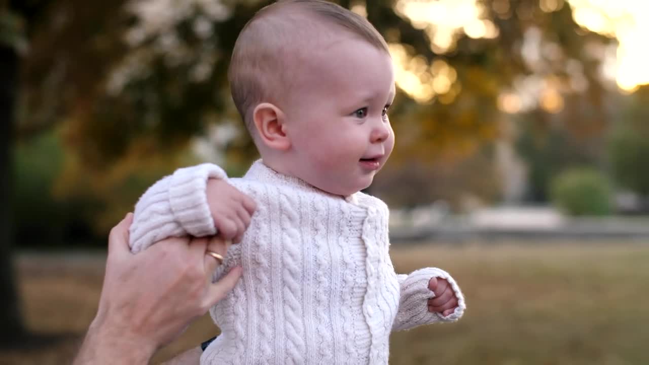 Stock Video Little Baby Walking Helped By His Father Animated Wallpaper