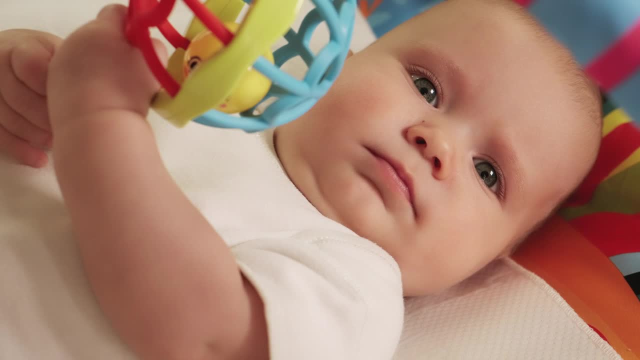 Stock Video Little Baby Playing With His Hanging Toy Animated Wallpaper