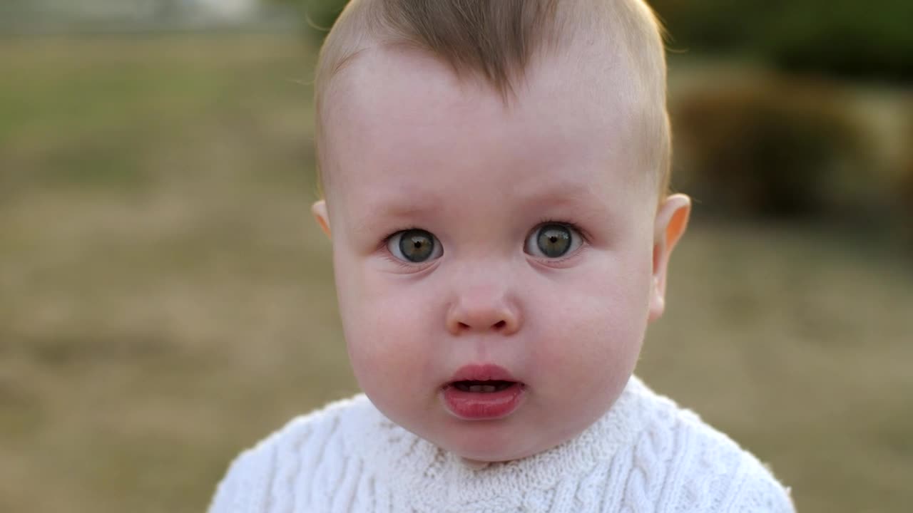 Stock Video Little Baby Looking Up At The Sky Portrait Animated Wallpaper