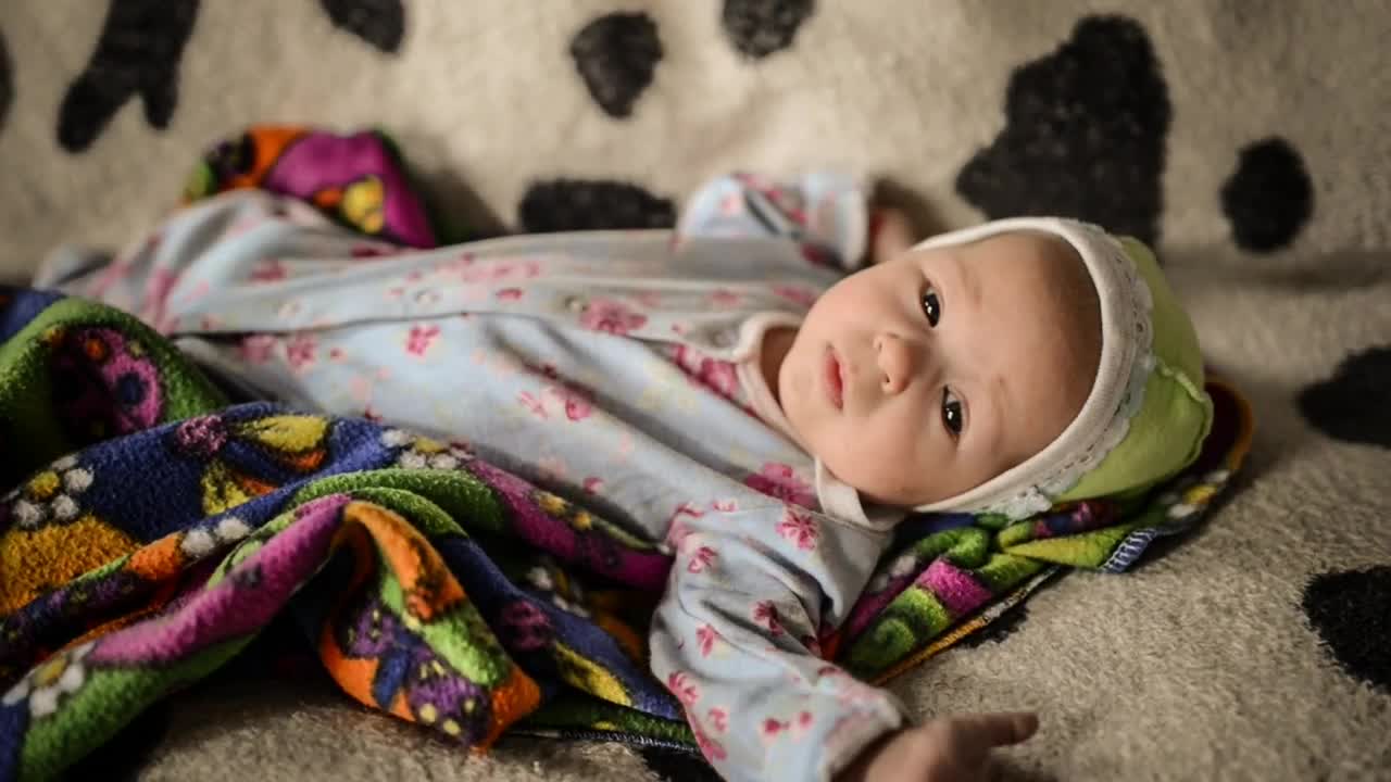 Stock Video Little Baby Lying In Pajamas Animated Wallpaper