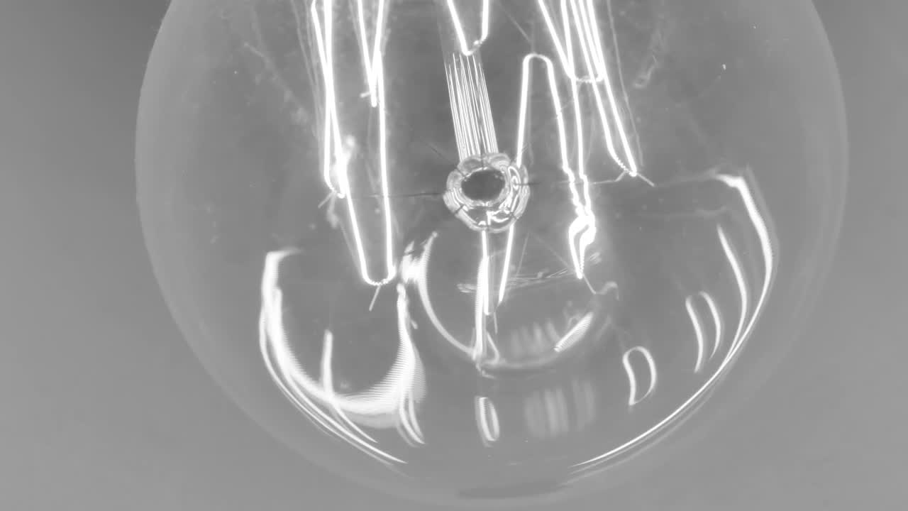 Stock Video Lit Filament Reflected In A Light Bulb Animated Wallpaper