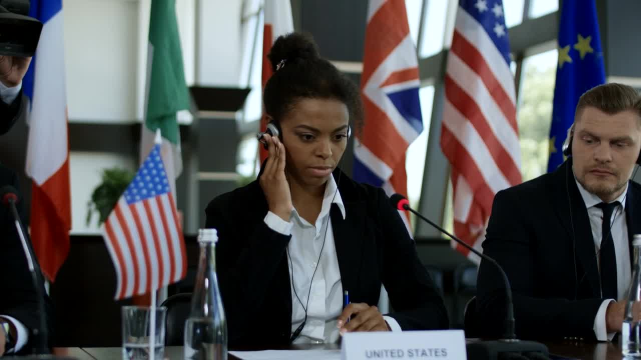 Stock Video Listening To Translation In An International Meeting Animated Wallpaper