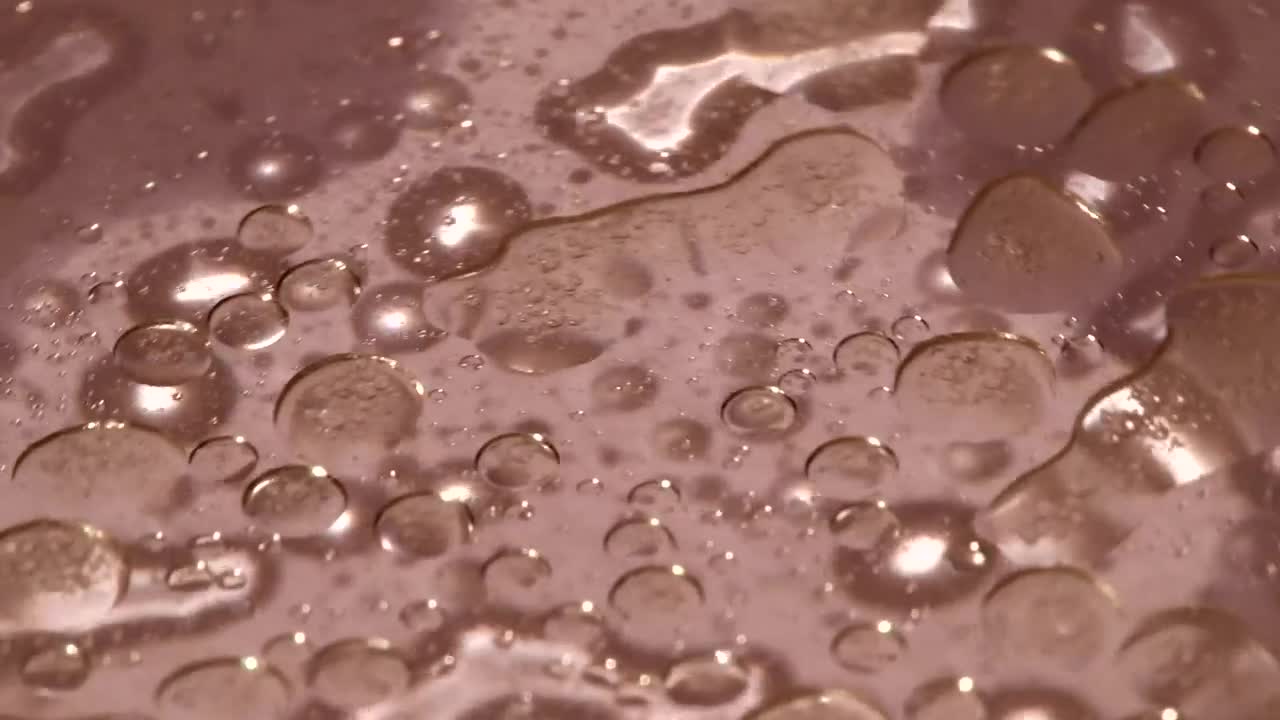 Stock Video Liquid On A Plastic Plate Animated Wallpaper