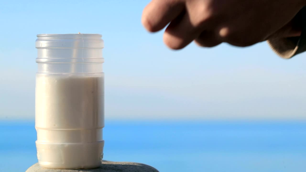 Stock Video Lighting A Candle With A Match Animated Wallpaper