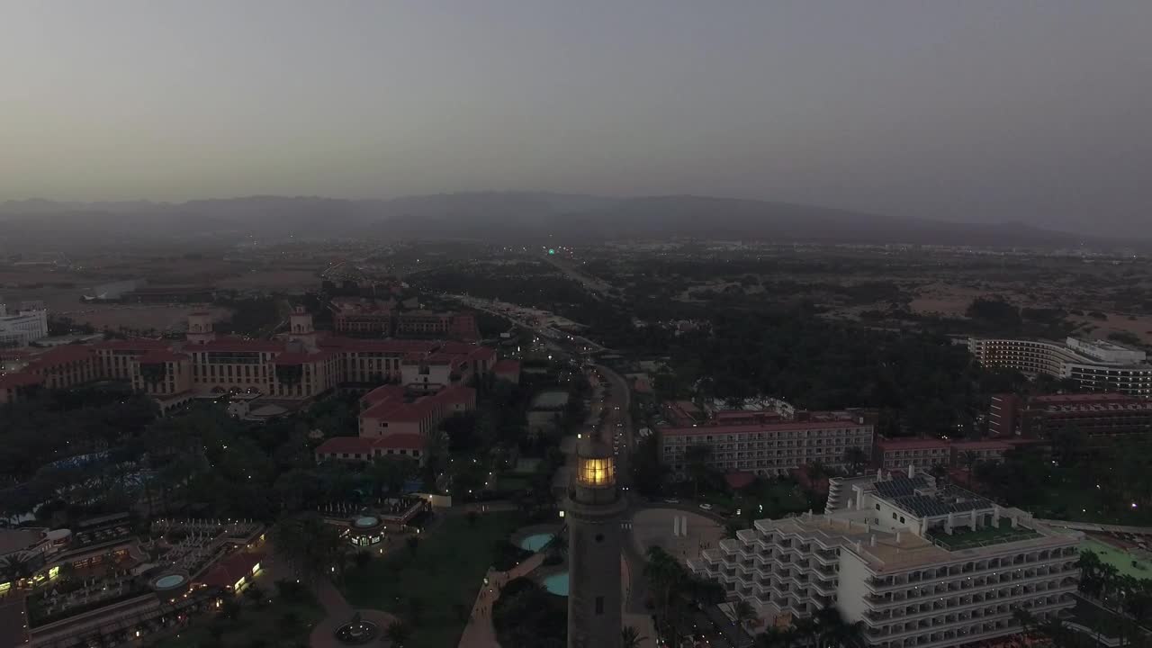 Stock Video Lighthouse At The Edge Of A Tourist Town Animated Wallpaper