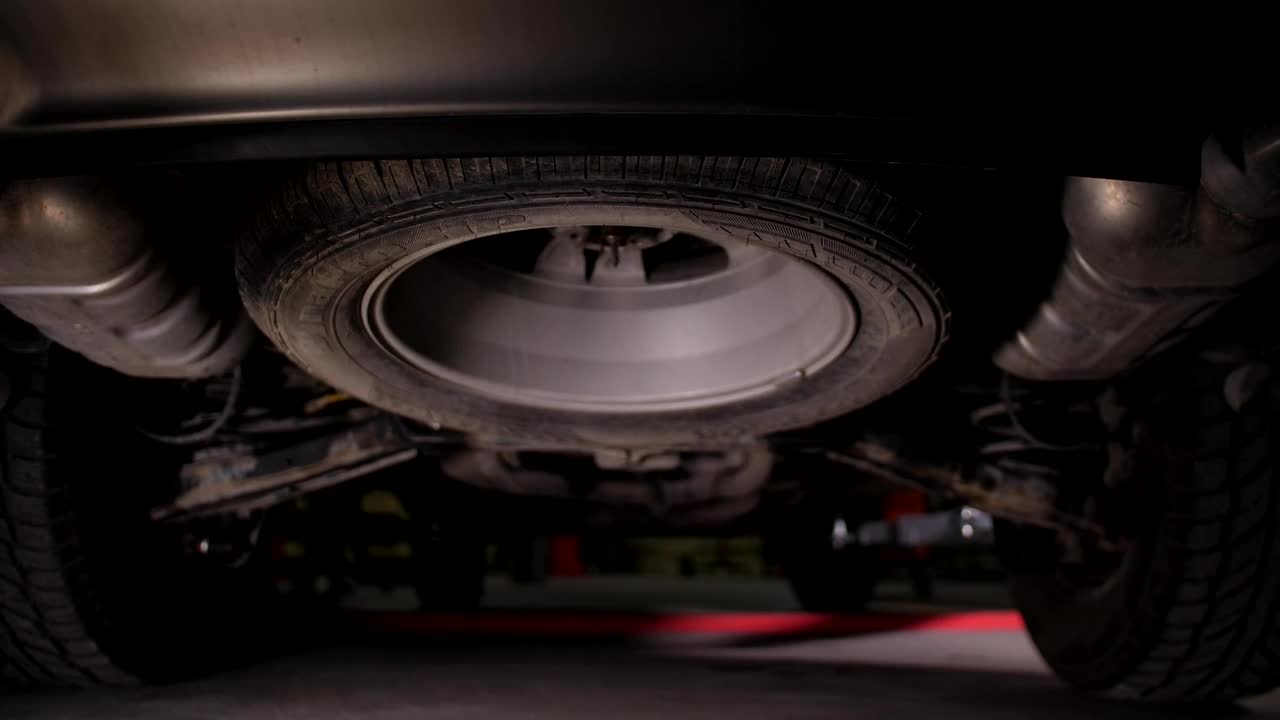 Stock Video Lifting A Car Inside A Workshop Animated Wallpaper