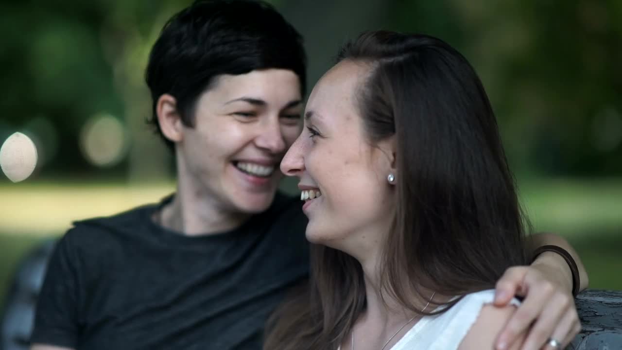 Stock Video Lgtbq Women Kiss And Talk On Park Bench Animated Wallpaper